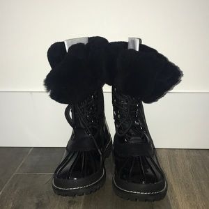 Coach rain boots. Brand new!! Size 6 1/2.